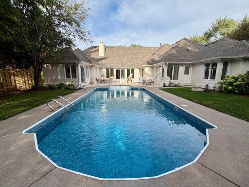 See the renovated pool before it is shut down for the season. The main level wraps around a private oasis with an updated pool, a large tile patio, and a fenced back yard. The pool has a brand new liner and a brand new filtration system.