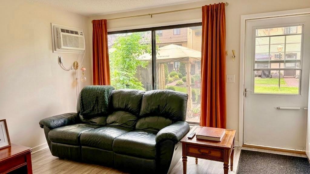 Open living and dining space with warm tones, large windows with bold drapes, and room to breathe inviting and livable from the moment you walk in.