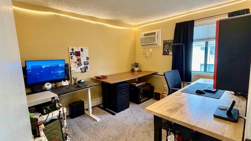 Dedicated workspace with shelving and natural light: work from home without sacrificing your sanity.