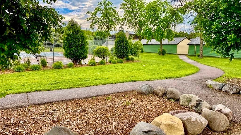 Expansive backyard green space with mature trees and open sky rare outdoor room that gives the property serious breathing room.