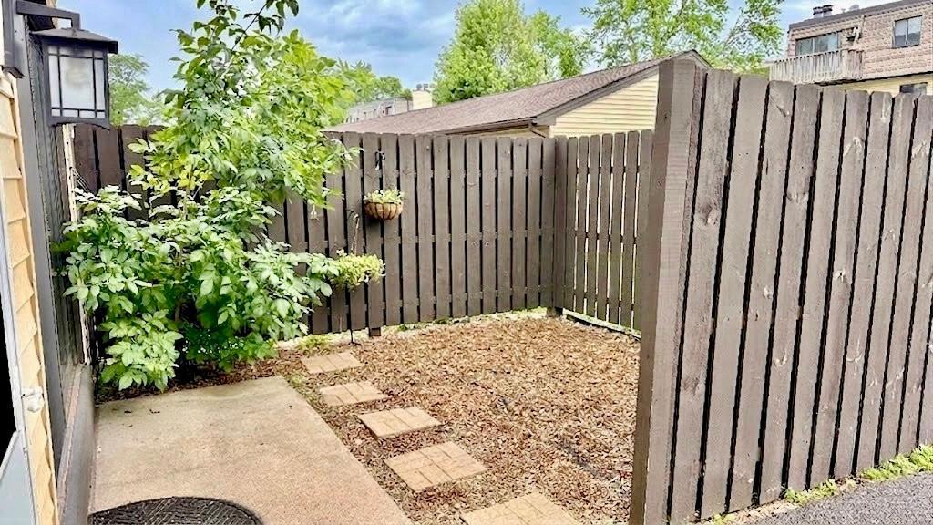 Fenced Outdoor Area
Private fenced outdoor space with wood panel fencing a secluded spot perfect for grilling, relaxing, or container gardening.