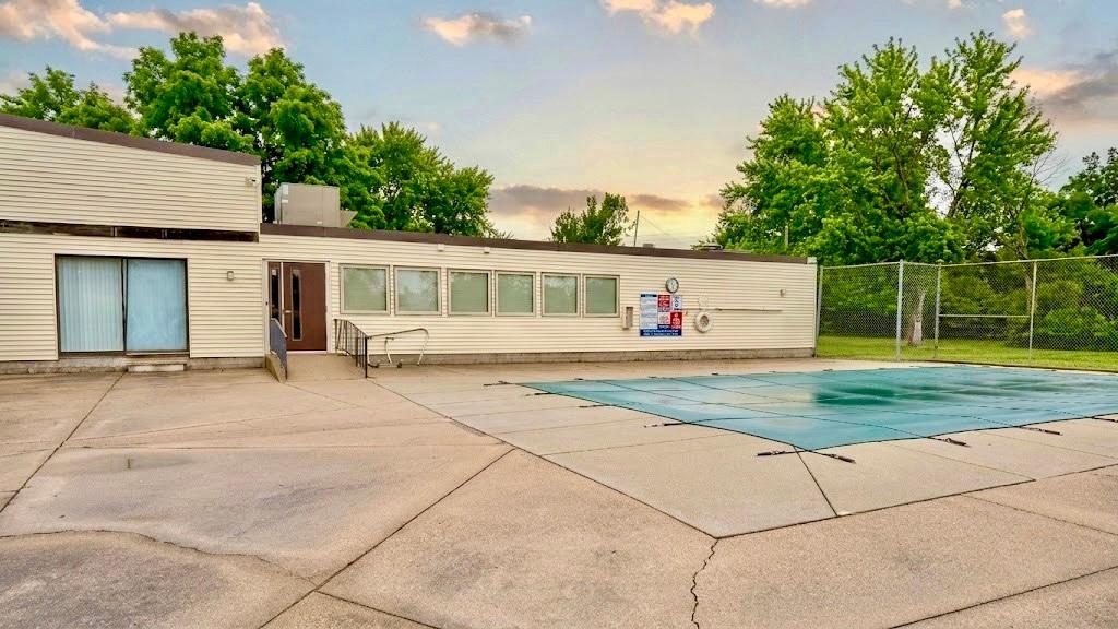 Full view of the community pool and surrounding patio space a resort-like amenity right outside your door.