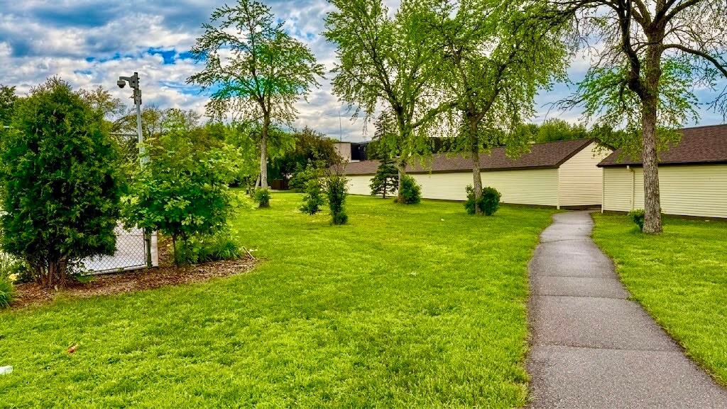 Additional exterior view showcasing the property's green surroundings and well-kept grounds the kind of setting that makes you want to stay.