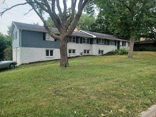 Sprawling Rambler on over a 1/2 acres overlooking Minneapolis Golf Course.