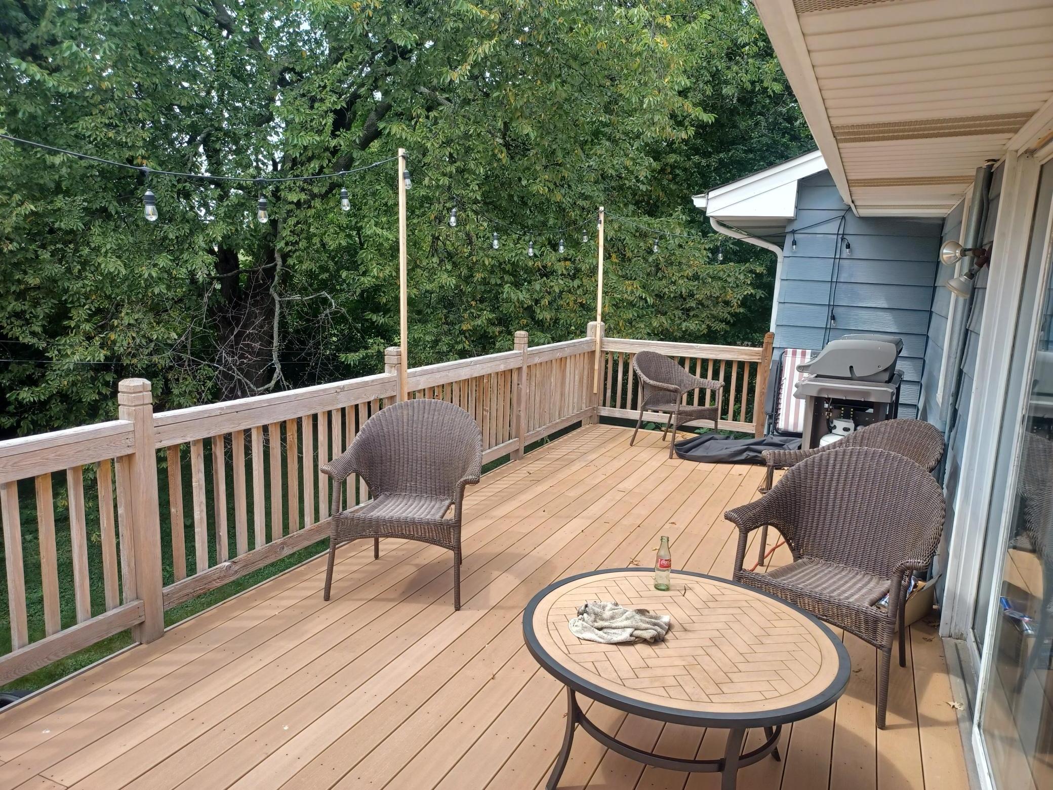 Maintenance free deck walks down to backyard.