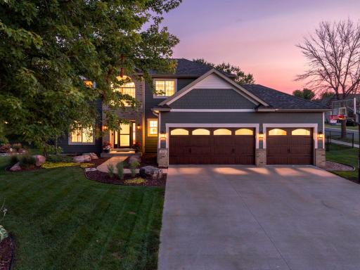 Beautifully updated two-story home with exceptional curb appeal, mature landscaping and an oversized three-car garage, creating a welcoming first impression.