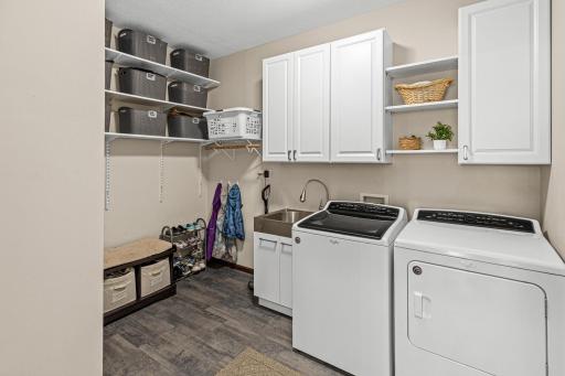Main floor laundry with utility sink