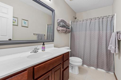 The upstairs hallway bathroom with full bathtub