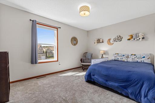 Bedroom 3 of 4 on upper level. 5 Total bedrooms!