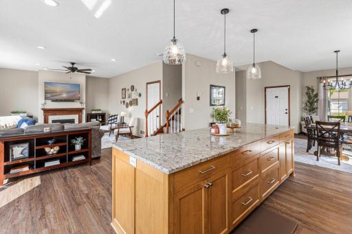 The kitchen is the center of the home and looks out to the adjacent living room with gas fireplace.