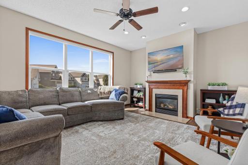 Oversized windows and gas fireplace make this a warm and welcoming spot to enjoy all year long