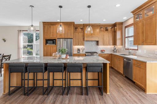 The professionally remodeled kitchen is a showstopper and the centerpiece of the home