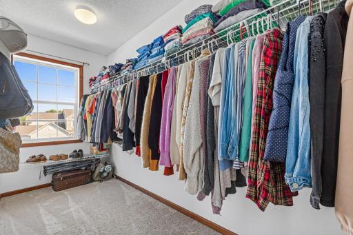 Get ready in your amazing primary walk-in closet while natural sunlight flows in