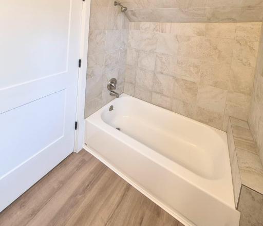 Tiled tub surround with new LVP flooring