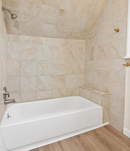 Bathroom Tub with Tile Surround and New LVP Flooring
