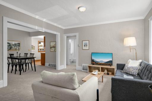 A large doorway provides a great open feel between the spacious living room and dining room