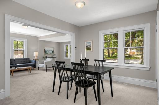 A large doorway provides a great open feel between the spacious living room and dining room