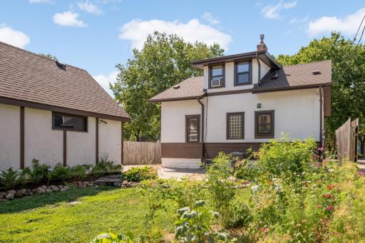 This home features beautiful natural landscaping and gardens, including a vegetable garden in the backyard