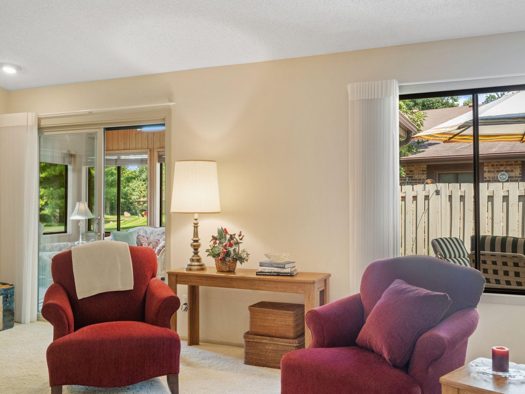 Large windows and sliding door to 3-season porch provide natural light to stream in.