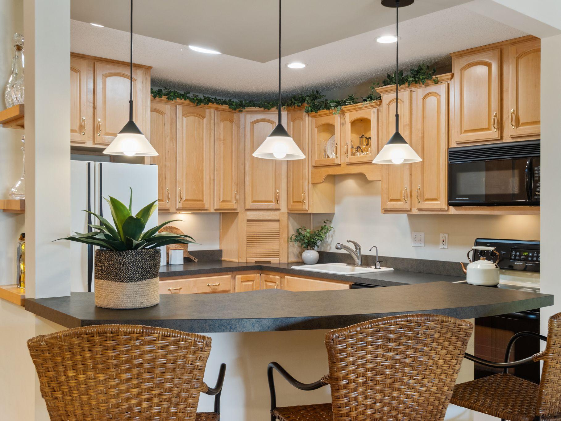 Remodeled kitchen, breakfast bar, beautiful cabinetry.