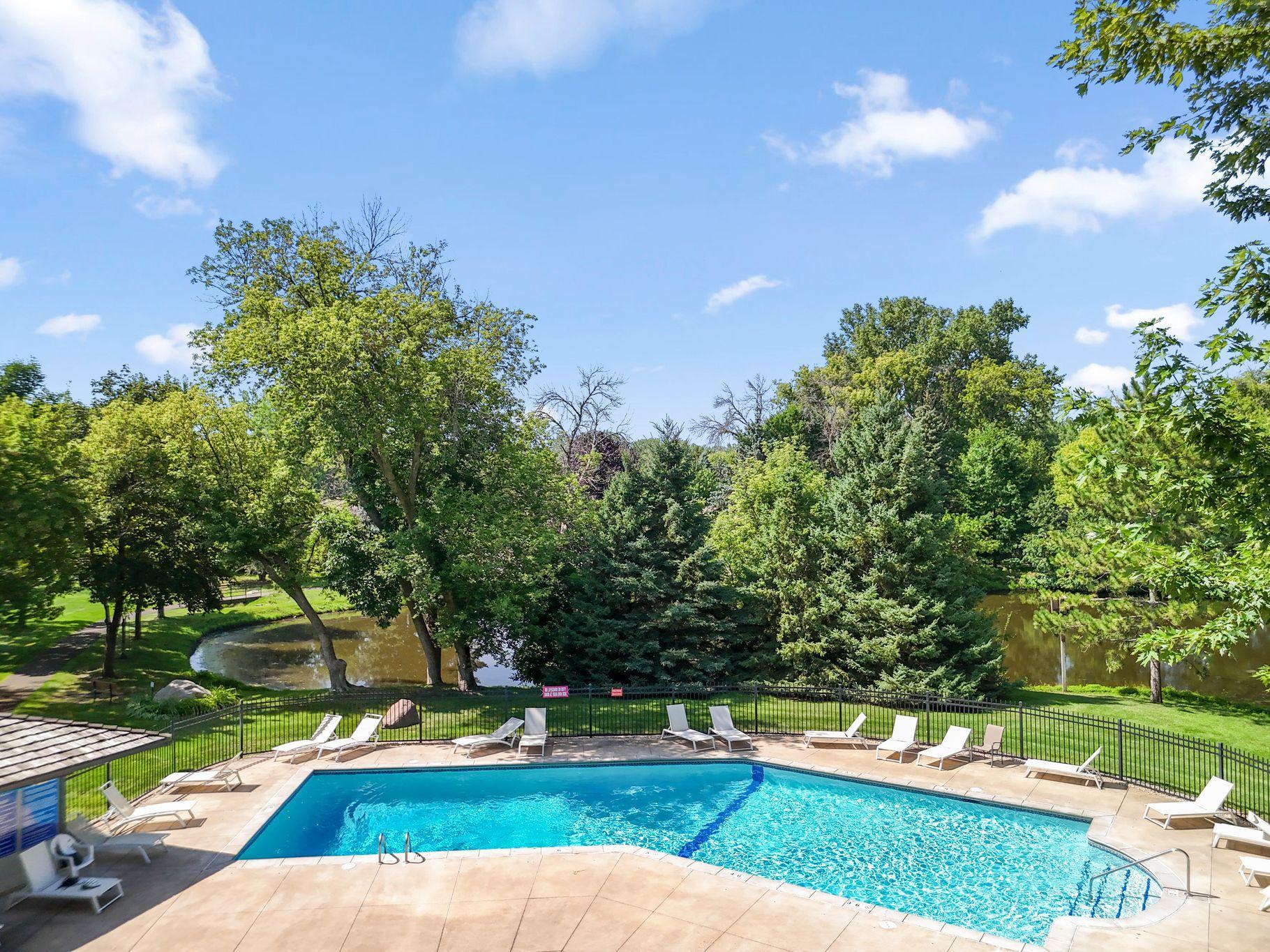 Outodoor inground pool is a short distance from this town home-just one of the reasons residents enjoy living in Cimarron Ponds.