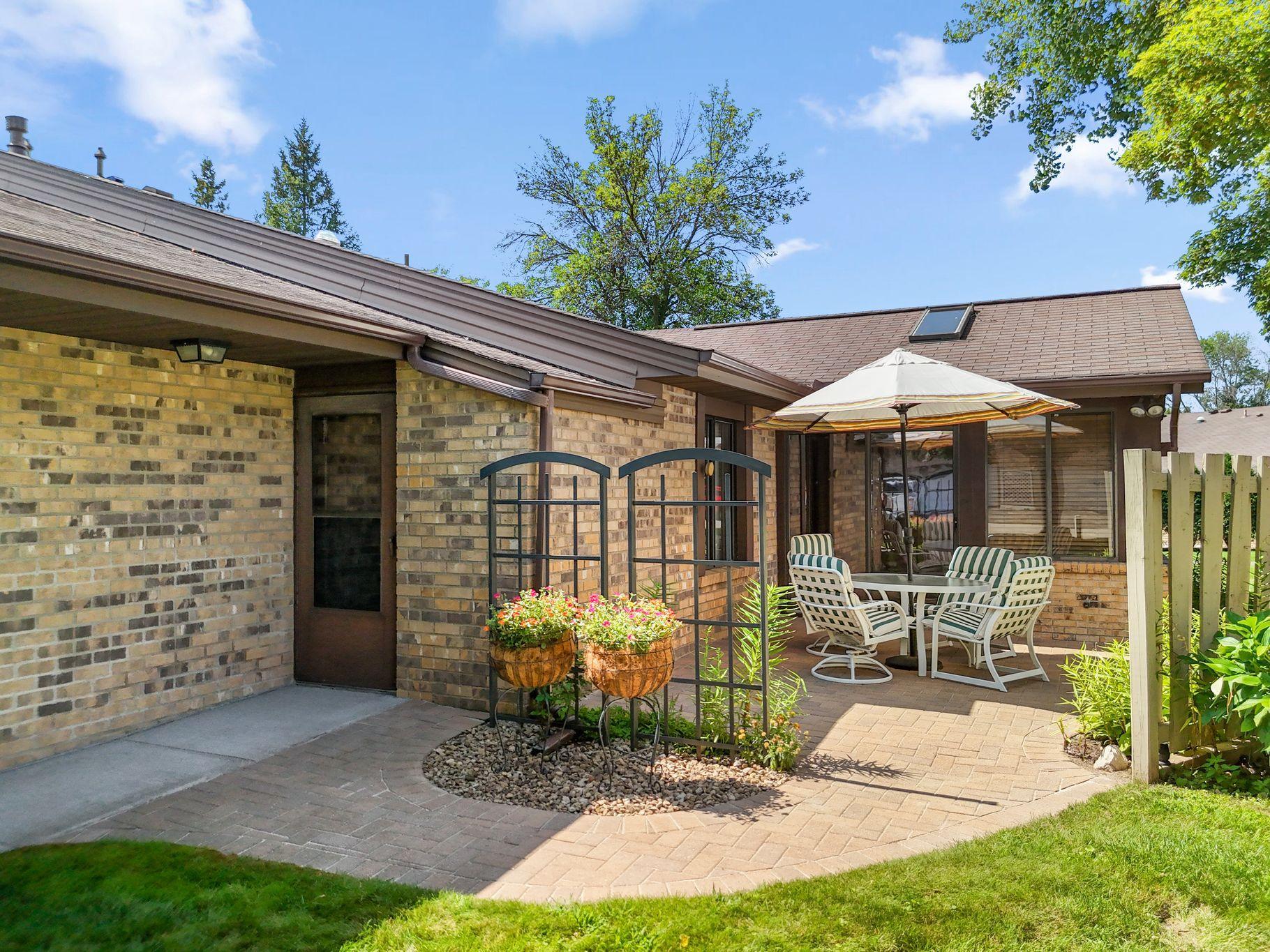 Beautiful paver patio leads to seating area just outside the 3-season porch.