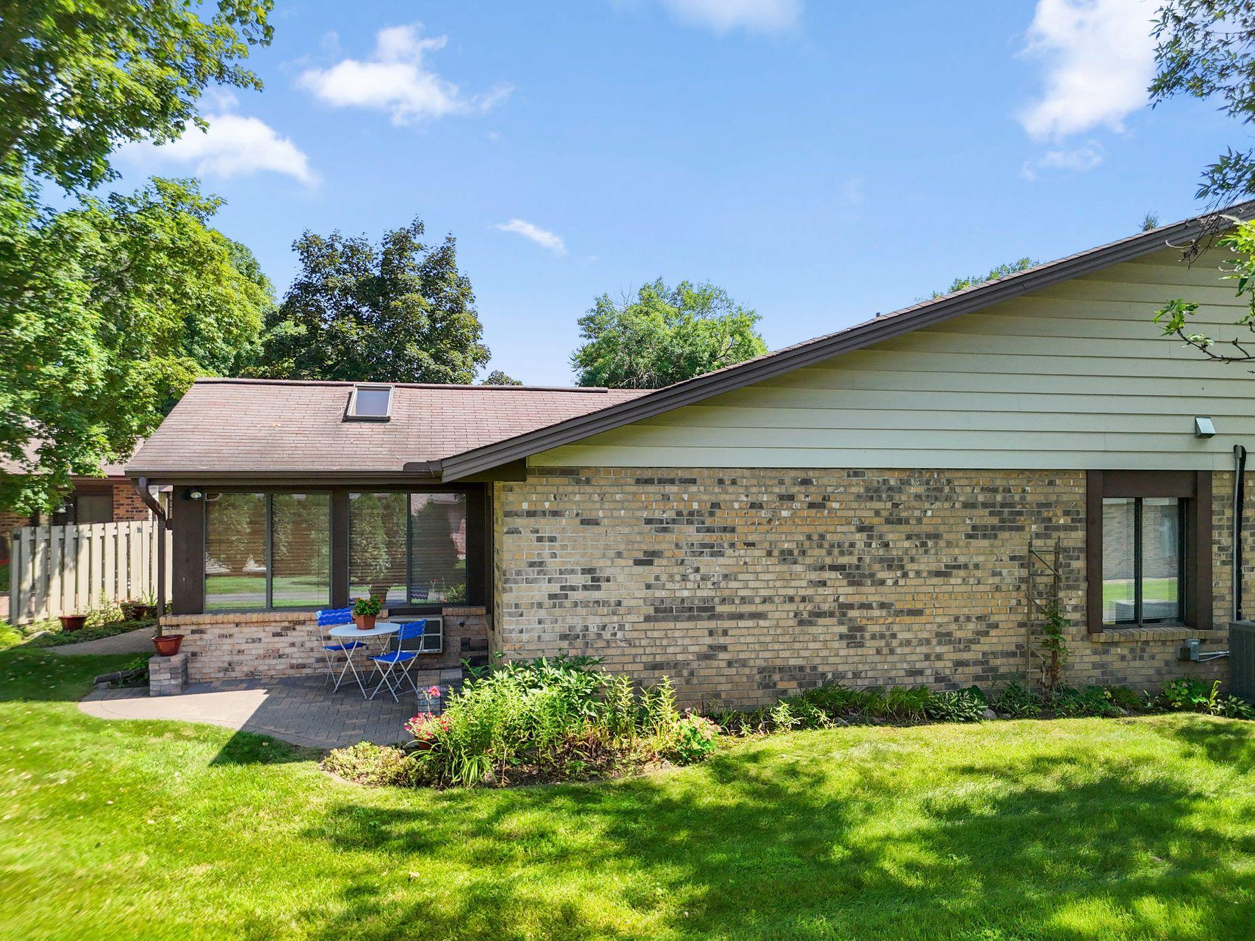 Single-level living with mature trees. Established perennials return year ofter year create a colorful backdrop without starting fresh each year.