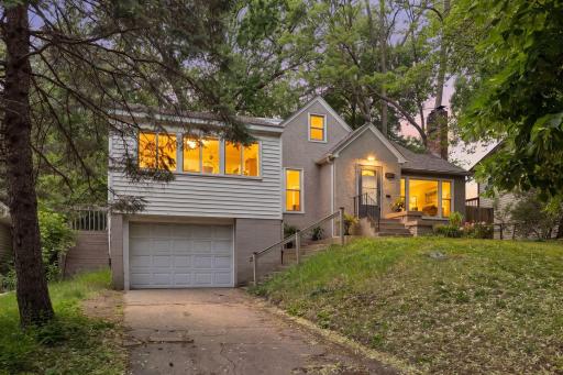 Twilight at 1233 Maywood Street. Set just above the street this quaint yet strikingly spacious 1.5 Story home boasts a main floor family room just off the kitchen and walks out to an expansive rear deck to the fenced backyard!