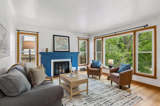 Filled with light this charming living room overlooks the street below.