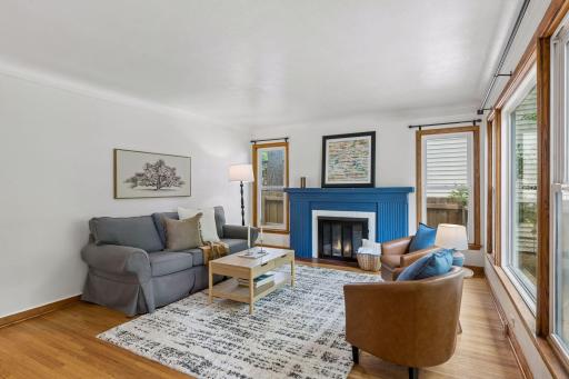 Charm and character meet modern updates; wood burning fireplace with wood mantel, newer windows and real hardwood flooring!