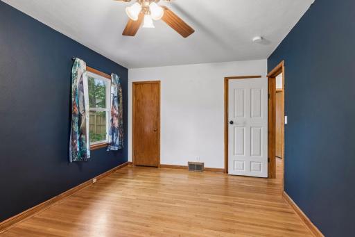 Another view of one of two generously sized main floor bedrooms.