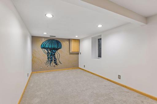 Lower Level Bedroom with new carpeting, egress window, walk-in closet and direct access to the 3/4 bathroom!