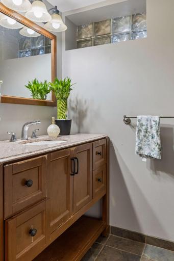 Lower level Bathroom - Tiled shower and flooring and built-in shelving!!