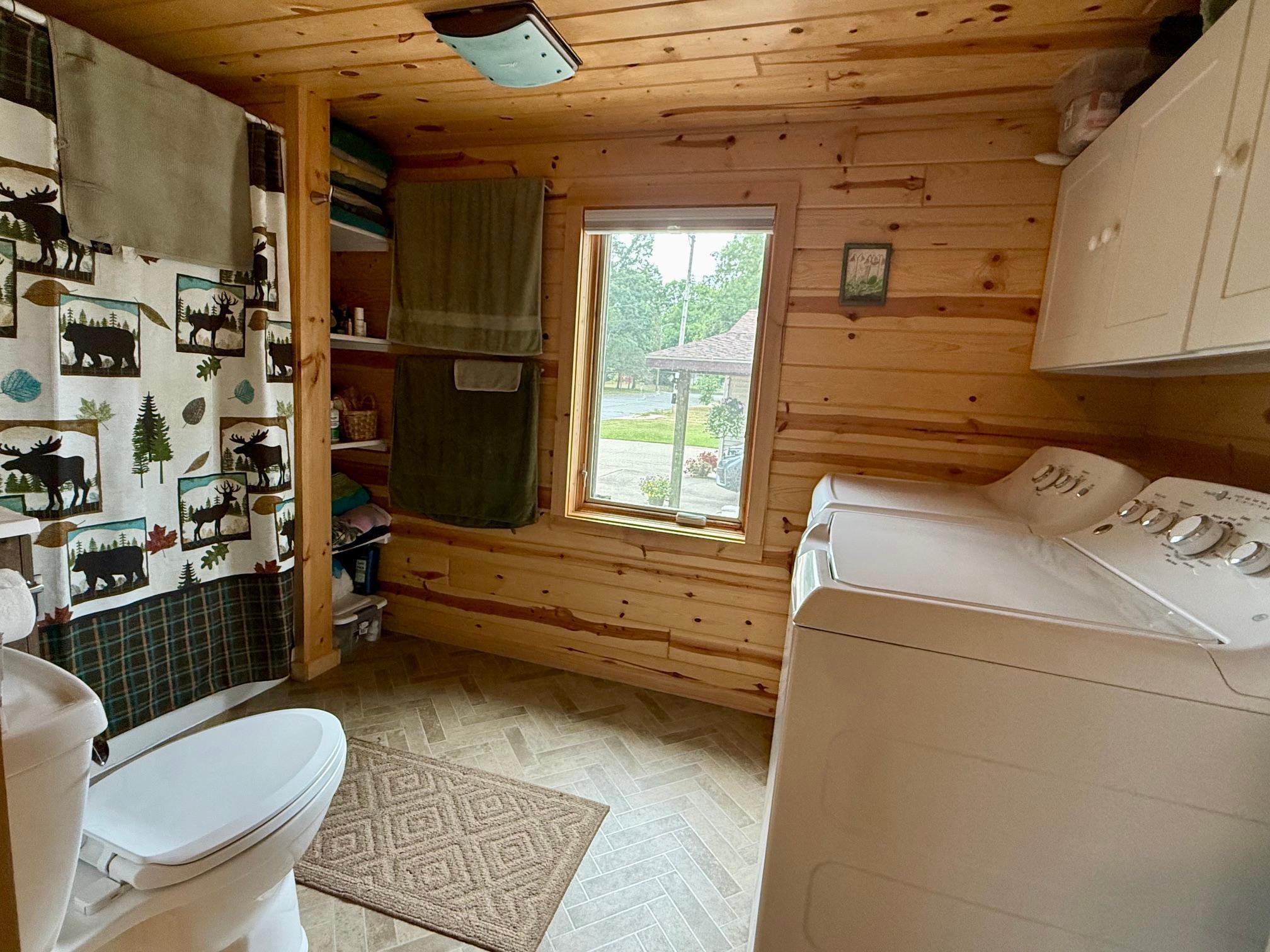 11-Main floor laundry and full bathroom with updates.jpeg