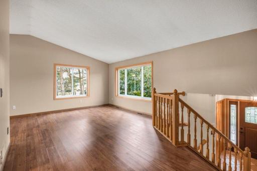 Walk upstairs to the newer LVP flooring and updated windows.