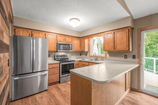 Kitchen window above the sink allows you to supervise and enjoy the outdoors while cleaning up!