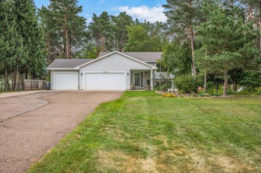 Triple attached garage plus and added cement parking pad