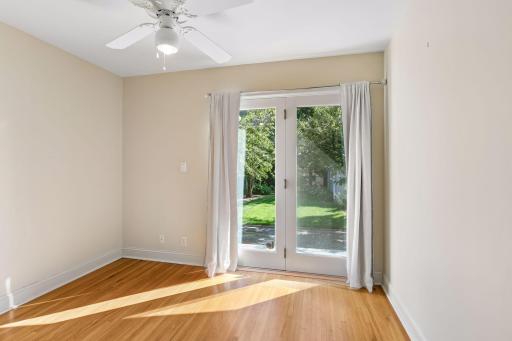 Second main floor bedroom with walkout to rear patio and backyard. Perfect option for an office or studio.