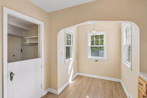 Kitchen has been freshly painted and features BRAND NEW vinyl plank flooring.