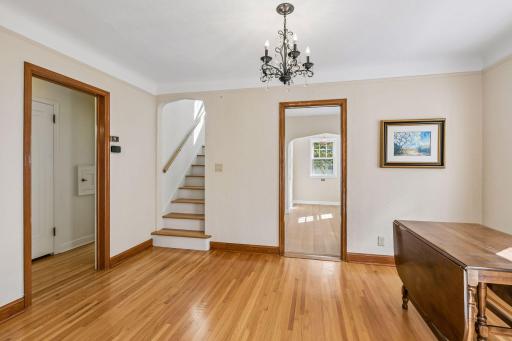 View into kitchen and lovely staircase to the owners suite.