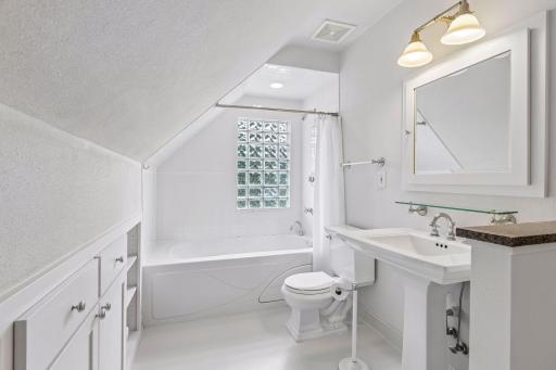 Crisp and clean, private owner suite full bath with jetted tub and custom built-ins.