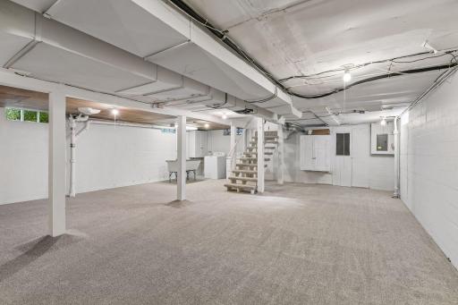 HUGE opportunity for additional living space in the lower level. BRAND NEW carpet and fresh paint - perfect rec or play room or frame and an additional bedroom.