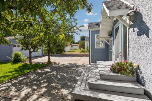 A lovely space for a patio set and al fresco dining under the shade trees.
