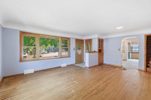 Living room with hardwood floors - carpet just pulled up