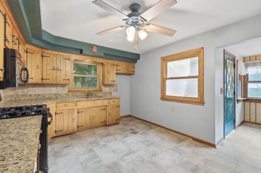 Kitchen opens to windowed dining/ flex room area