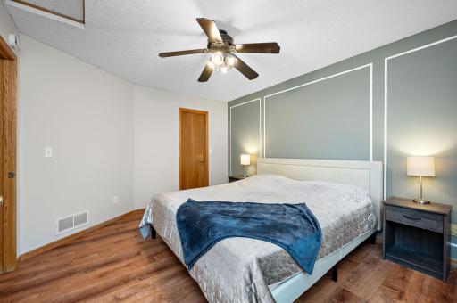 Large primary bedroom with walk in closet.