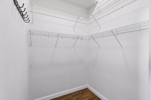 Walk-in closet, with three levels of shelves that make great use of the 10-foot ceilings.