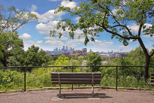 View of Minneapolis from Tower Park: "Home to the Witch’s Hat water tower, the natural splendor of Tower Hill, with its wooded, hilly terrain, has been popular with park goers for over a century."
