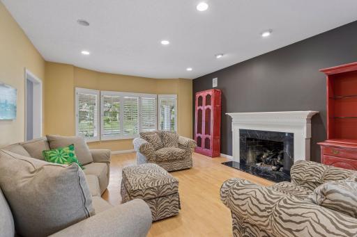 Living room with gas fireplace and wooden floors