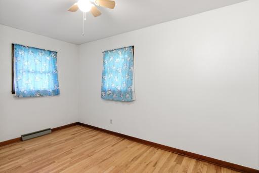 Main Level Bedroom 2 with hardwood flooring